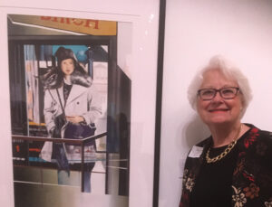 Cheryl Fausel in front of award winning painting